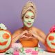 Girl in facemask with pumpkins