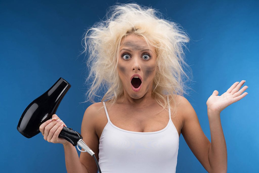 Young blonde woman with shocked hair